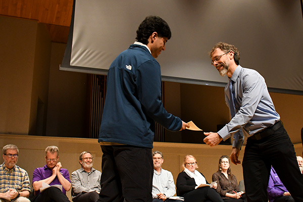 Student receiving academic award Student receiving academic award