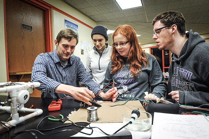 Students and Myers constructing Remotely Operated Vehicle (ROV)