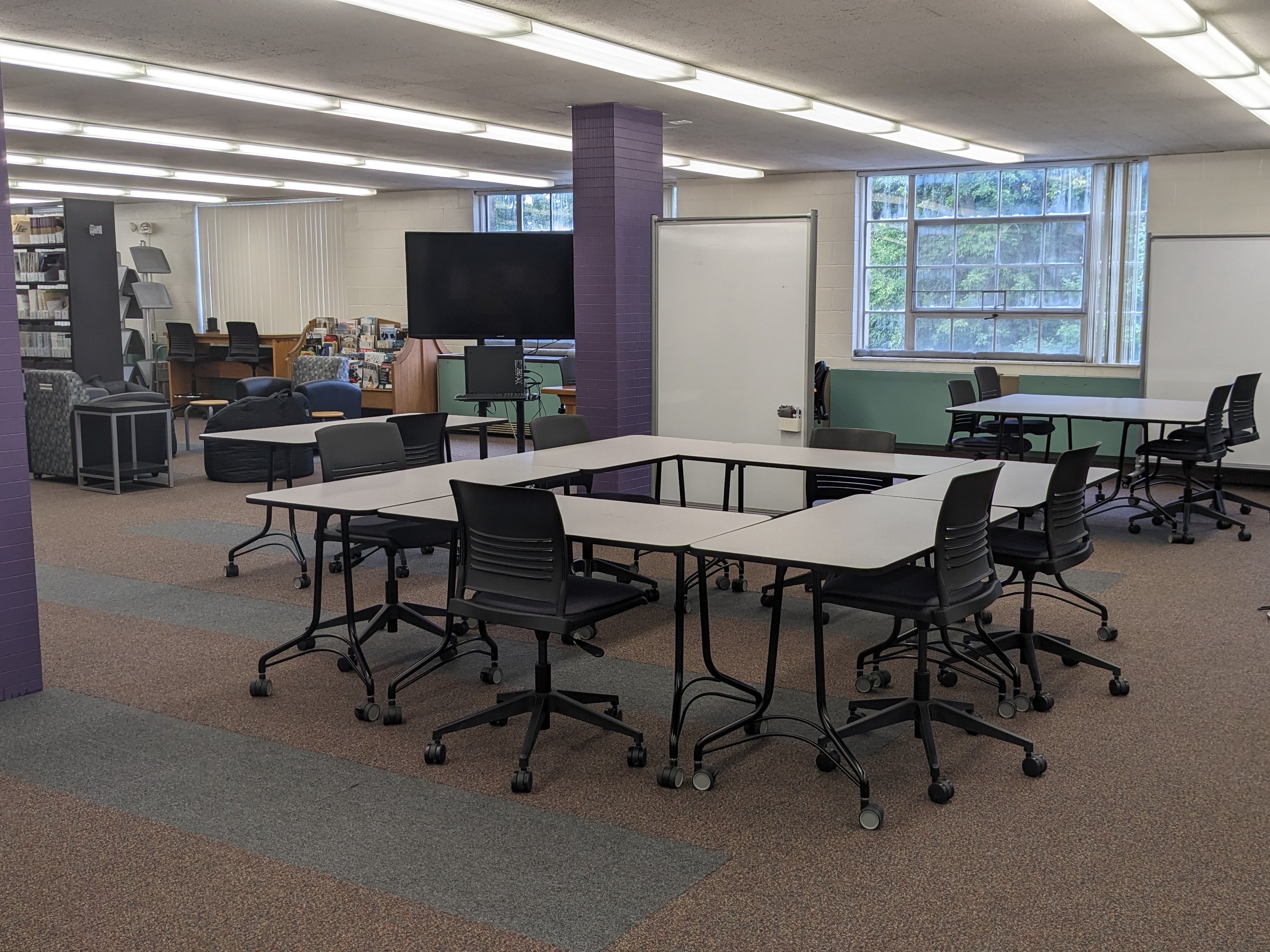 Tables, chairs, and whiteboards in this space are on wheels -- arrange the furniture to make your perfect study space