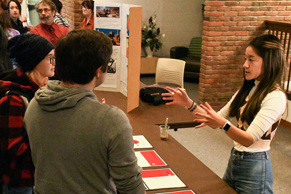 Risa Fukaya ’22, a social work major from Zushi, Japan, talks with students as part of PEACE Club’s presentation during Civic Engagement Day.