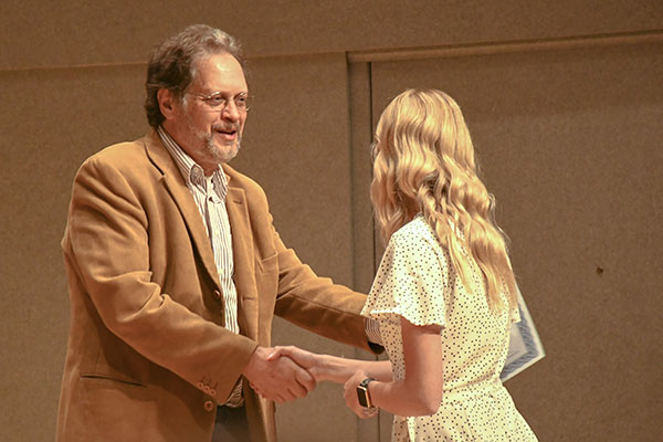 Perry Bush presented departmental honors to Grace Branson for her independent study history project, “The Impact of Total War on Bluffton College.”
