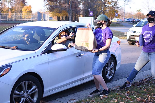 President Jane Wood picks up her meal at the 2020 Harvest Dinner.