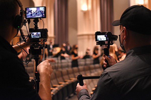 Chad Stearns ’00 and Cody Ridenour ’08, co-owners of Modo Media, video new footage for the 